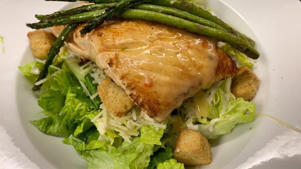 Salmon Salad · Salmon, romaine lettuce, parmesan cheese, croutons and caesar dressing. Served with grilled asparagus.