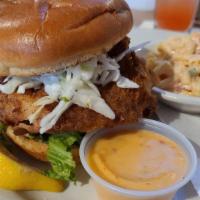 Big Fish Sandwich · Fried wild caught Atlantic cod, lettuce and tomato topped with sunset remoulade sauce.