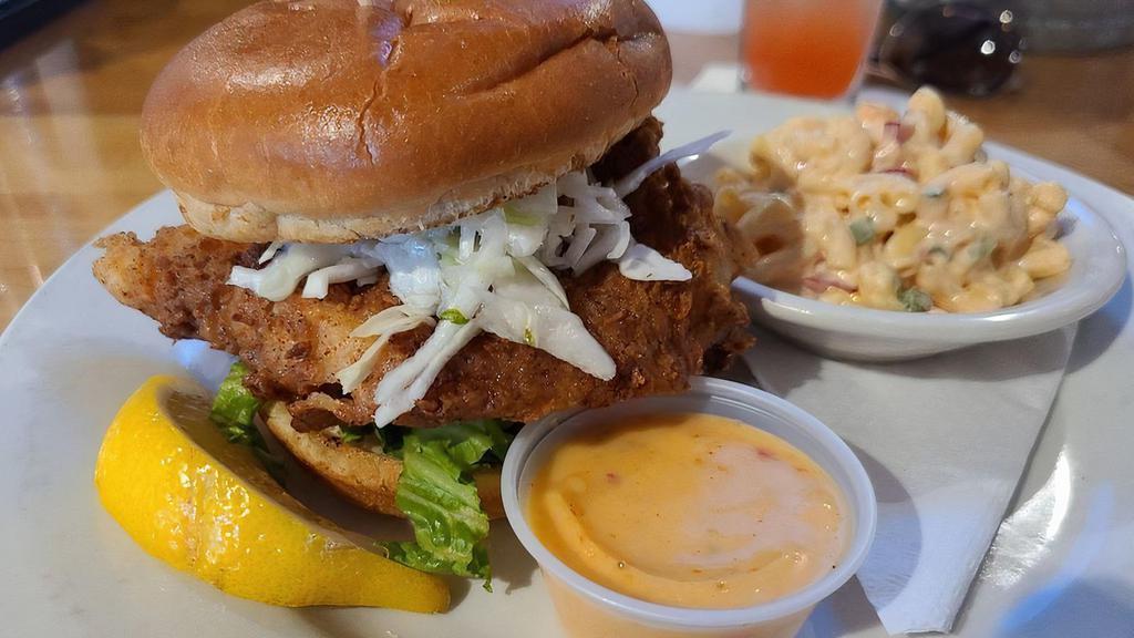Big Fish Sandwich · Fried wild caught Atlantic cod, lettuce and tomato topped with sunset remoulade sauce.