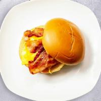 Vegan Bacon Icon Breakfast Sandwich · Scrambled vegan egg, vegan bacon, and vegan cheese served on a ciabatta bun with a drizzle o...