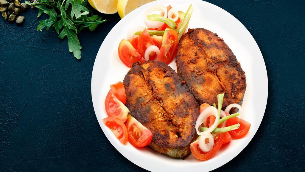 Traditional Masala Fish Fry · Sizzling boneless fish deep fried with fresh veggies in traditional masala