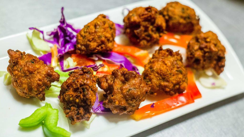 Pakora · Traditional south Asian fritters, lentil flour and spices.