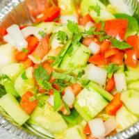 Cucumber Salad · Cucumbers, tomatoes, onions and tangy spices.