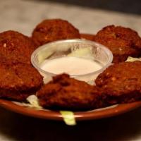 Falafel 5Pcs · Ground chickpeas, fava beans, garlic, onion, tahini and spieces.