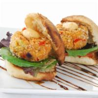Crab Cakes · Patty stuffed with mouth watering crab meat served with a drizzle of tartar sauce.