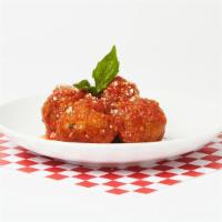 Meatballs · Four juicy meatballs in our house marinara sauce.