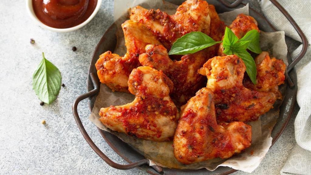 Italian Baked Chicken Wings (8 Pcs) · 8 lightly seasoned chicken wings tossed with Italian dressing. Served with customer's choice of dipping sauce.