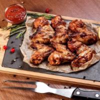 Roasted Garlic Bbq Wings · Delicious wings sprinkled with special seasonings, tossed in roasted garlic BBQ sauce, and b...