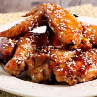 Sweet Teriyaki Wings · Delicious wings sprinkled with special seasonings, tossed in sweet teriyaki sauce, and baked...