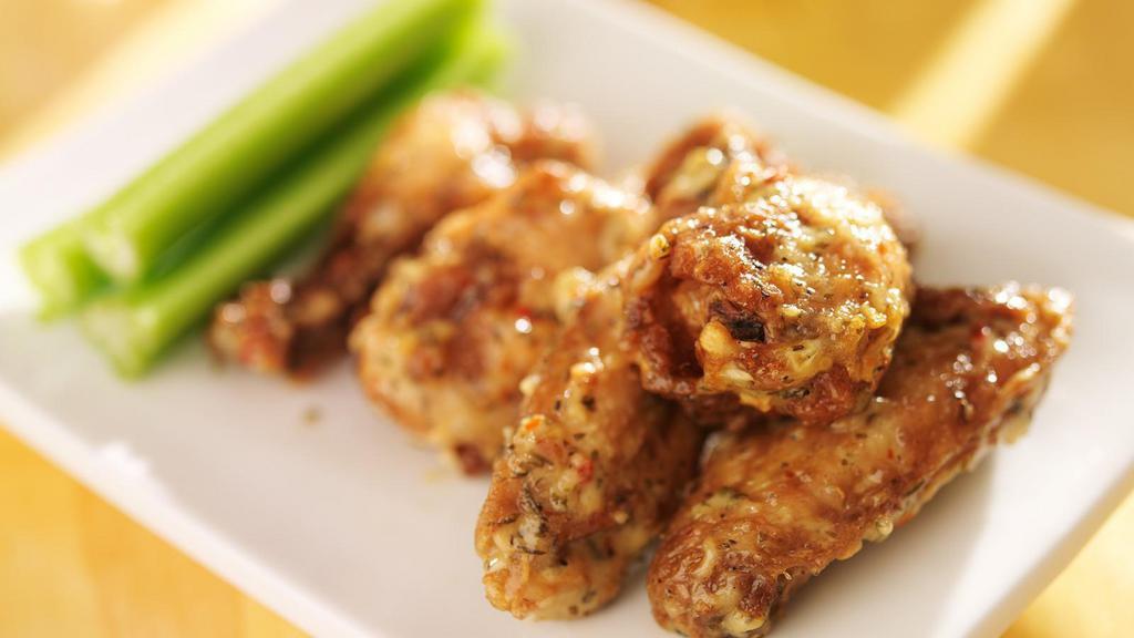 Garlic Parmesan Wings · Delicious wings sprinkled with special seasonings, tossed in a garlic Parmesan sauce, and baked to perfection. Served with customer's choice of dipping sauce.