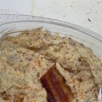Potato Salad W/ Bacon · Homemade Potato Salad with our house Seasoning Blend, cajun mustard and Bacon!