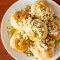 Garlic Knots  · Bread Twisted in knots and smothered in Fresh Garlic ,Olive oil and Italian seasoning . Orde...