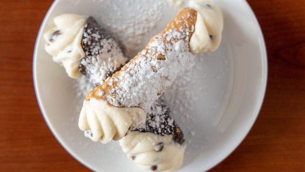 Traditional Cannoli · A favorite Italian dessert!  Our traditional shell stuffed with Sweet Ricotta cheese and chocolate chips.