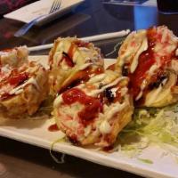 Monkey Brain Rolls · Deep-fried sushi rolls with crab Cream cheese and avocado with spicy mayo and eel sauce.