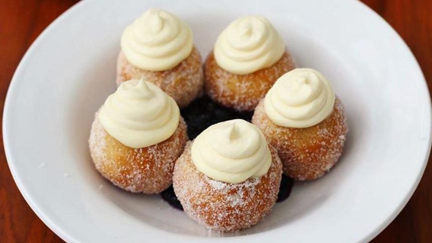 Bonuts · Fried Biscuit Dough, Tossed in Sugar, Topped with Lemon Mascarpone, Served Over Blueberry Compote. Order of 5.