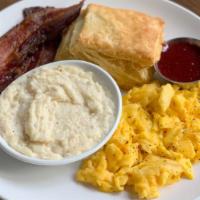 Egg Plate · 2 Eggs Any Style, Cheese Grits, Buttermilk Biscuit, Jam, Choice of Bacon or Sausage.