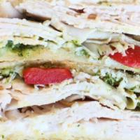 Hot Mama · Smoked turkey, cream cheese, pesto, tomato, onion and roasted red peppers, served on sourdou...