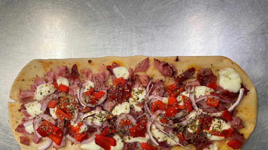 Italian Flatbread Pizza · Genoa salami, pepper ham, capicolla ham,
fresh mozzarella, red onion, roaster red
peppers, olive ol, red wine vinegar and
oregano