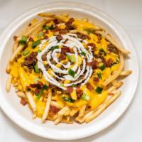 Fully Loaded Fries · Shoestring Fries topped with seasoned ground beef, bacon bits, green onion, cheese, and sour...