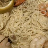 Shrimp Scampi · Fresh garlic and basil with white wine sauce over angel hair pasta.