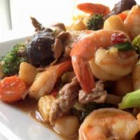 Triple Delight · Shrimp, Chicken, Beef, Sauteed with Mushrooms, Bamboo Shoots, Snow Peas, Broccoli, and Chine...