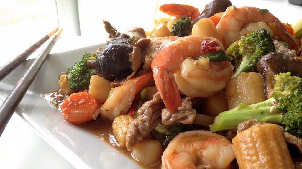 Triple Delight · Shrimp, Chicken, Beef, Sauteed with Mushrooms, Bamboo Shoots, Snow Peas, Broccoli, and Chinese Vegetables