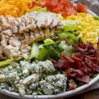 Chicken Cobb Salad · grilled chicken, eggs, tomatoes, red onion, cheese and  bacon, served over  mixed greens wit...