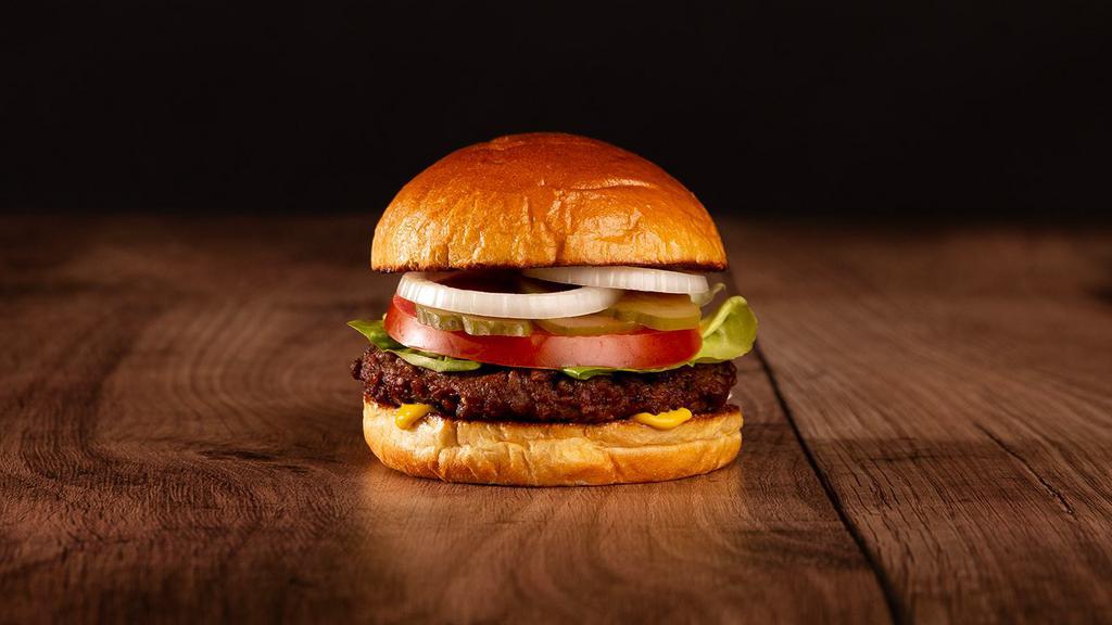 The Impossible Burger · Impossible patty, lettuce, tomato, onion, pickles, and stone ground dijon on a brioche bun.