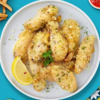 Garlic Parmesan Boneless Wings · Breaded boneless chicken breast chunks fried to perfection, tossed in our house made garlic ...