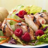 Raspberry Pecan Chicken Salad · Fresh green lettuce mixed with grilled chicken, chopped pecans, mandarin oranges and crumble...