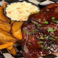Baby Back Ribs · Served with slaw and choice of side.