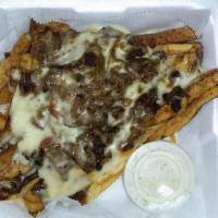Philly Fries · A basket of fresh cut fries topped with Philly steak, cheese, onions, bell peppers with a si...