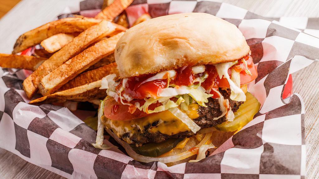 American · The classic american burger served on a sweet sourdough bun with American cheese, lettuce, onions, tomato, pickles, ketchup, mustard, and mayonnaise.