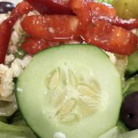 Greek Island Salad · Greek salad topped with our homemade spinach pie and Greek dressing.