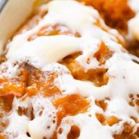 Sweet Potato Casserole · Topped with marshmallows, cinnamon, brown sugar, and butter.
