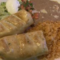 Chimichanga · Two flour tortillas stuffed with choice of beef tips, chicken or ground beef, deep fried, an...