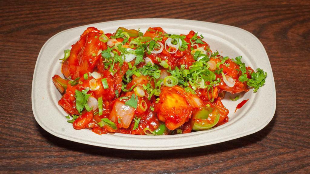 Paneer Chili · Crisp cubes of paneer tossed around in Manchurian sauce with Thai green chili peppers, sweet bell peppers, and onions.