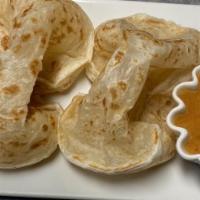 Roti · Asian flatbread accompanied with a panang curry sauce for dipping.