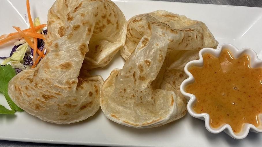 Roti · Asian flatbread accompanied with a panang curry sauce for dipping.