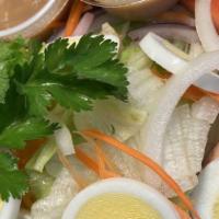 S-1. Gourmet Thai Salad · Lettuce, tomatoes, cucumbers, onions, and eggs served with a peanut dressing.