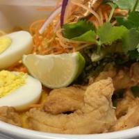 Curry Noodle Soup (Kao Soi) · Fried Chicken Tender with yellow curry, pickled mustard greens and steamed egg noodle.