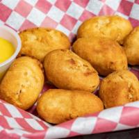 Mini Corn Dogs · 10 mini corn dogs cooked to perfection. Served with honey mustard.