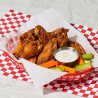 Chicken Wings · Crispy chicken wings tossed in your choice of sauce.