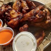 Smoked Wings (6) · 6 wings, seasoned and smoked to perfection, served straight up or tossed in Buffalo or BBQ s...