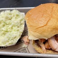 Pulled Chicken Sandwich · Pulled selects of our slow-smoked chicken on a bun. Your choice of vinegar or house BBQ sauc...