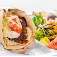 Falafel Pita- · Fried ground chickpeas with herbs wrapped in a pita served with hummus, lettuce, tomatoes, t...