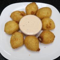 Yuca Bites · Golden yuca | melted cheese.