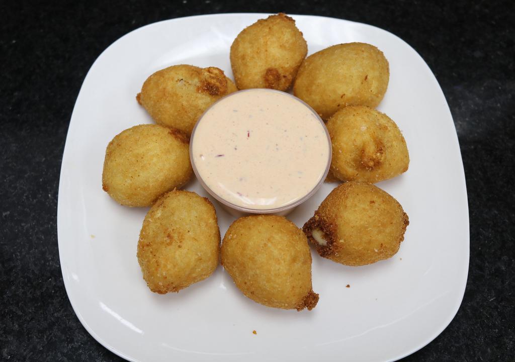 Yuca Bites · Golden yuca | melted cheese.