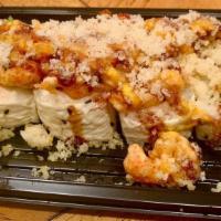 Puff Daddy Roll · Snow carb roll with soy paper, topped with spicy fried crawfish and crunch flakes with eel s...
