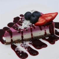 Lemonberry Cheesecake · mixed berries, lemon, vanilla, cashews, pecan crust topped with coconut and berry coulis